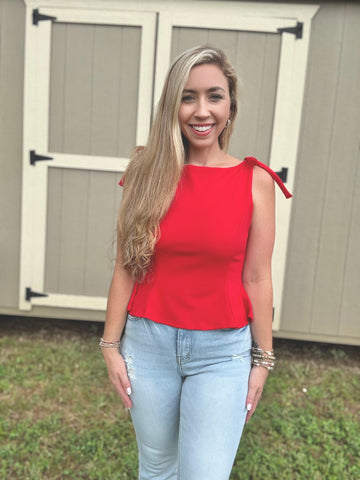 Stand Out Bow Peplum Top