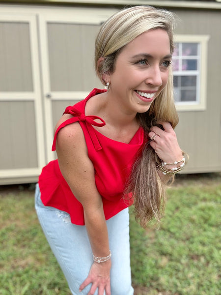 Stand Out Bow Peplum Top