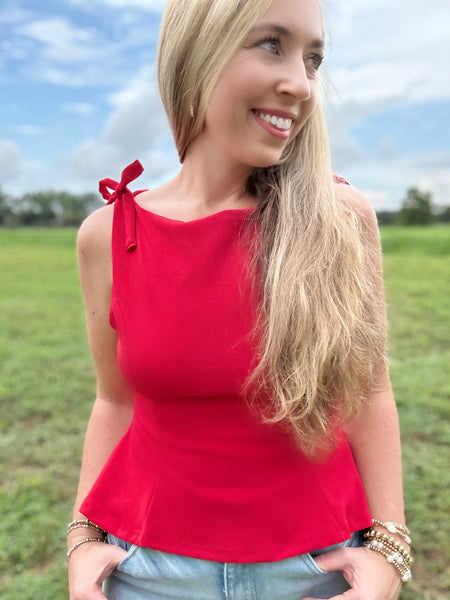 Stand Out Bow Peplum Top