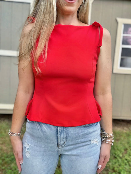 Stand Out Bow Peplum Top